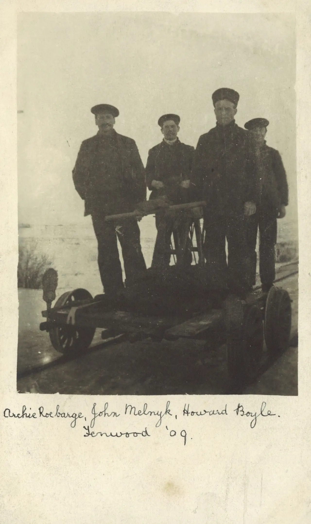Four men on a railway handcar, 1909