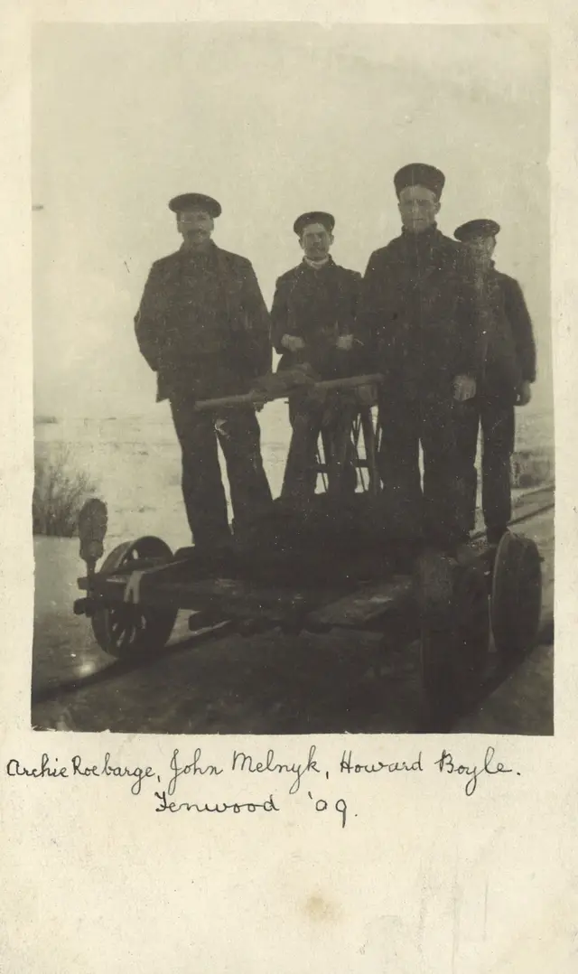 Four men on a railway handcar